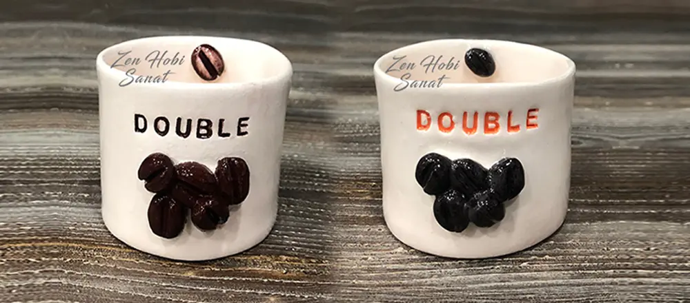 Kahve çekirdeği desenli iki 'Double' yazılı el yapımı seramik fincan